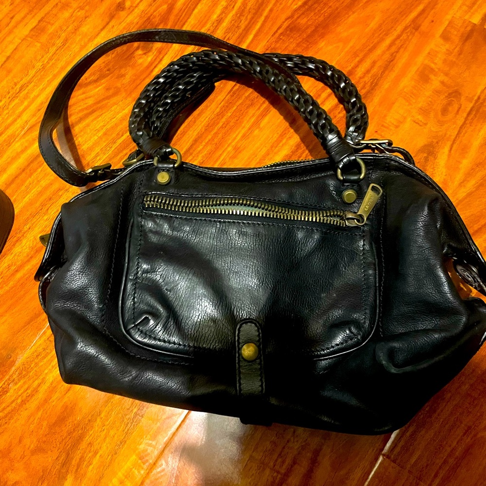 Black leather roomy bag with shoulder strap and chrome hardware